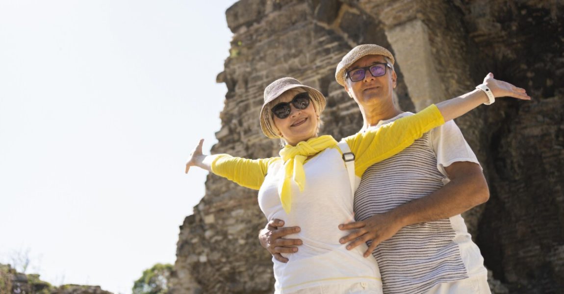 low-angle-couple-posing-vacation